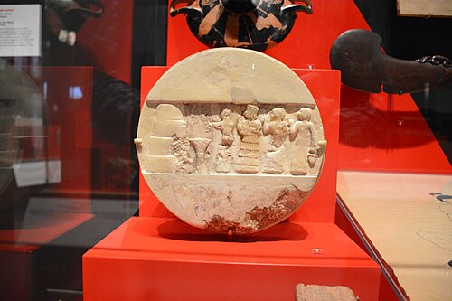 The alabaster Disk of Enheduanna, showing the priestess presiding over an offering