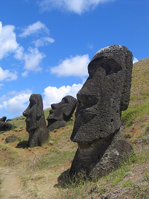 Moai standing in the slope of the Rano Raraku quarry on Rapa Nui